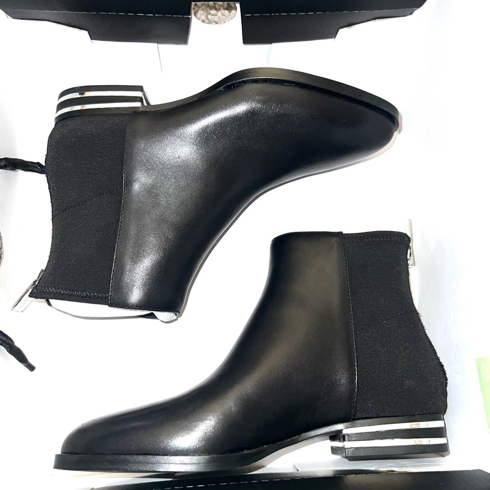 Black ankle boot with silver detail.